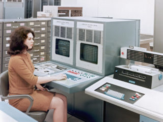 01 Jan 1966, Houston, Texas, USA --- Sandy McGee at the Laboratory Universal Control computerized lab controls using IBM equipment --- Image by © Pete Vazquez/Science Faction/Corbis
